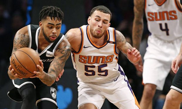 Brooklyn Nets guard D'Angelo Russell (1) scoops the ball away from Phoenix Suns guard Mike James (5...