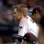 Arizona Diamondbacks starting pitcher Zack Greinke (21) watches from the dugout after being pulled from the game during the sixth inning of game 3 of baseball's National League Division Series against the Los Angeles Dodgers, Monday, Oct. 9, 2017, in Phoenix. (AP Photo/Rick Scuteri)