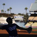Los Angeles Dodgers bullpen catcher Steve Cilladi throws during batting practice before Game 1 of the baseball team's National League Division Series against the Arizona Diamondbacks in Los Angeles, Friday, Oct. 6, 2017. (AP Photo/Jae C. Hong)