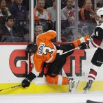 Arizona Coyotes' Tobias Rieder, of Germany, right, checks Philadelphia Flyers' Radko Gudas, of the Czech Republic, left, along the boards during the first period of an NHL hockey game, Monday, Oct. 30, 2017, in Philadelphia. (AP Photo/Chris Szagola)