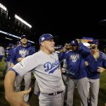 Los Angeles Dodgers' Enrique Hernandez celebrates with his teammates celebrate after Game 5 of baseball's National League Championship Series against the Chicago Cubs, Thursday, Oct. 19, 2017, in Chicago. The Dodgers won 11-1 to win the series and advance to the World Series. (AP Photo/Matt Slocum)