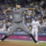 Arizona Diamondbacks starting pitcher Taijuan Walker throws to a Los Angeles Dodgers batter during first inning of Game 1 of a baseball National League Division Series in Los Angeles, Friday, Oct. 6, 2017. (AP Photo/Jae C. Hong)