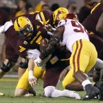 Arizona State quarterback Manny Wilkins (5) is sacked by Southern California defensive lineman Rasheem Green (94) during the first half of an NCAA college football game, Saturday, Oct. 28, 2017, in Tempe, Ariz. (AP Photo/Ralph Freso)