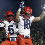 Arizona wide receiver Shun Brown (6) celebrates his touchdown reception with Cedric Peterson (18) during the second half of an NCAA college football game against California Saturday, Oct. 21, 2017, in Berkeley, Calif. Arizona won 45-44 in overtime. (AP Photo/Marcio Jose Sanchez)