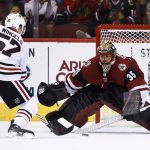 Arizona Coyotes' Louis Domingue (35) blocks the penalty shot by Chicago Blackhawks' Tommy Wingels (57) during the second period of an NHL hockey game Saturday, Oct. 21, 2017, in Glendale, Ariz. (AP Photo/Ross D. Franklin)