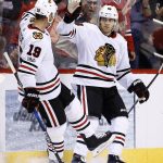 Chicago Blackhawks' Patrick Kane, right, celebrates his goal against the Arizona Coyotes with Jonathan Toews (19) during the second period of an NHL hockey game Saturday, Oct. 21, 2017, in Glendale, Ariz. (AP Photo/Ross D. Franklin)