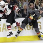 Vegas Golden Knights defenseman Brayden McNabb, right, checks Arizona Coyotes left wing Anthony Duclair during the second period of an NHL hockey game Tuesday, Oct. 10, 2017, in Las Vegas. (AP Photo/John Locher)