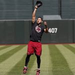 Arizona Diamondbacks' Gregor Blanco jumps for a ball before a workout for the National League wild card playoff baseball game, Tuesday, Oct. 3, 2017, in Phoenix. The Diamondbacks face the Colorado Rockies in a single game elimination playoff game on Wednesday. (AP Photo/Matt York)