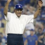 Former Los Angeles Dodger Don Newcombe waves before throwing out the first pitch at Game 1 of the baseball team's National League Division Series against the Arizona Diamondbacks in Los Angeles, Friday, Oct. 6, 2017. (AP Photo/Jae C. Hong)