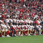 Members of the San Francisco 49ers kneel during the national anthem as others stand during the first half of an NFL football game against the Arizona Cardinals, Sunday, Oct. 1, 2017, in Glendale, Ariz. (AP Photo/Rick Scuteri)