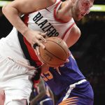 Portland Trail Blazers center Jusuf Nurkic drives to the basket past Phoenix Suns forward Dragan Bender during the first half of an NBA basketball preseason game in Portland, Ore., Tuesday, Oct. 3, 2017. (AP Photo/Steve Dykes)