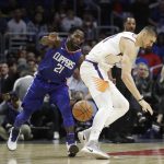 Los Angeles Clippers' Patrick Beverley, left, steals the ball from Phoenix Suns' Alex Len during the second half of an NBA basketball game Saturday, Oct. 21, 2017, in Los Angeles. The Clippers won 130-88. (AP Photo/Jae C. Hong)