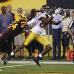 Southern California wide receiver Deontay Burnett (80) catches a touchdown pass as Arizona State defensive back Chase Lucas (24) defends during the first half of an NCAA college football game, Saturday, Oct. 28, 2017, in Tempe, Ariz. (AP Photo/Ralph Freso)