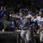 Los Angeles Dodgers' Enrique Hernandez (14) celebrates after hitting a grand slam during the third inning of Game 5 of baseball's National League Championship Series against the Chicago Cubs, Thursday, Oct. 19, 2017, in Chicago. (AP Photo/Matt Slocum)