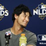 Los Angeles Dodgers starting pitcher Yu Darvish, of Japan, laughs after answering a question during a news conference before Game 3 of baseball's National League Division Series against the Arizona Diamondbacks, Sunday, Oct. 8, 2017, in Phoenix. (AP Photo/Ross D. Franklin)