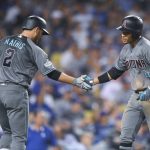 Arizona Diamondbacks' Ketel Marte, right, celebrates his home run with Jeff Mathis during the seventh inning of Game 1 of the baseball team's National League Division Series against the Los Angeles Dodgers in Los Angeles, Friday, Oct. 6, 2017. (AP Photo/Mark J. Terrill)