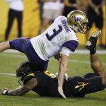 Washington quarterback Jake Browning (3) gets taken down by Arizona State's Jay Jay Wilson (9) during the first half of an NCAA college football game, Saturday, Oct. 14, 2017, in Tempe, Ariz. (AP Photo/Ross D. Franklin)
