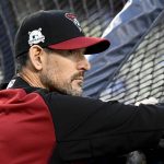 Arizona Diamondbacks manager Torey Lovullo watches batting practice for Game 1 of the baseball team's National League Division Series against the Los Angeles Dodgers in Los Angeles, Friday, Oct. 6, 2017. (AP Photo/Mark J. Terrill)