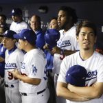 Los Angeles Dodgers starting pitcher Kenta Maeda stands in the dugout before Game 1 of the baseball team's National League Division Series against the Arizona Diamondbacks in Los Angeles, Friday, Oct. 6, 2017. (AP Photo/Jae C. Hong)