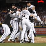 The Arizona Diamondbacks celebrate after the National League wild-card playoff baseball game against the Colorado Rockies, Wednesday, Oct. 4, 2017, in Phoenix. The Diamondbacks won 11-8 to advance to the NLDS against the Los Angeles Dodgers. (AP Photo/Matt York)