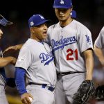 Los Angeles Dodgers starting pitcher Yu Darvish (21) is pulled from the game by manager Dave Roberts (30) during the sixth inning of game 3 of baseball's National League Division Series against the Arizona Diamondbacks, Monday, Oct. 9, 2017, in Phoenix. (AP Photo/Ross D. Franklin)