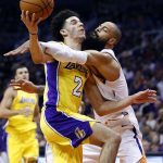 Phoenix Suns center Tyson Chandler fouls Los Angeles Lakers guard Lonzo Ball (2) during the first half of an NBA basketball game, Friday, Oct. 20, 2017, in Phoenix. (AP Photo/Matt York)