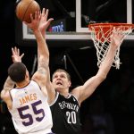 Phoenix Suns guard Mike James (55) shoots as Brooklyn Nets center Timofey Mozgov (20) defends in the first half of an NBA basketball game, Tuesday, Oct. 31, 2017, in New York. (AP Photo/Kathy Willens)
