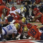 UCLA running back Jalen Starks (32) scores a touchdown against Arizona in the first half during an NCAA college football game, Saturday, Oct. 14, 2017, in Tucson, Ariz. (AP Photo/Rick Scuteri)