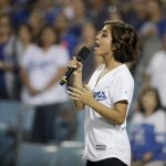 Actress Isabela Moner sings the national anthem before Game 1 of baseball's National League Division Series between the Los Angeles Dodgers and the Arizona Diamondbacks in Los Angeles, Friday, Oct. 6, 2017. (AP Photo/Jae C. Hong)