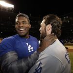 Los Angeles Dodgers' Yasiel Puig and Charlie Culberson celebrate after Game 5 of baseball's National League Championship Series against the Chicago Cubs, Thursday, Oct. 19, 2017, in Chicago. The Dodgers won 11-1 to win the series and advance to the World Series. (AP Photo/Matt Slocum)