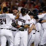 The Arizona Diamondbacks celebrate after the National League wild-card playoff baseball game against the Colorado Rockies, Wednesday, Oct. 4, 2017, in Phoenix. The Diamondbacks won 11-8 to advance to an NLDS against the Los Angeles Dodgers. (AP Photo/Ross D. Franklin)