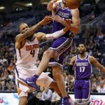 Phoenix Suns center Tyson Chandler (4) is fouled by Sacramento Kings center Kosta Koufos during the second half of an NBA basketball game, Monday, Oct. 23, 2017, in Phoenix. The Suns won 117-115. (AP Photo/Matt York)