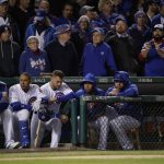 Chicago Cubs players watch from the dugout during the ninth inning of Game 5 of baseball's National League Championship Series against the Los Angeles Dodgers, Thursday, Oct. 19, 2017, in Chicago. (AP Photo/Matt Slocum)