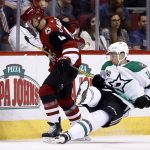 Arizona Coyotes defenseman Niklas Hjalmarsson (4) sends Dallas Stars center Tyler Pitlick, right, to the ice during the first period of an NHL hockey game Thursday, Oct. 19, 2017, in Glendale, Ariz. (AP Photo/Ross D. Franklin)