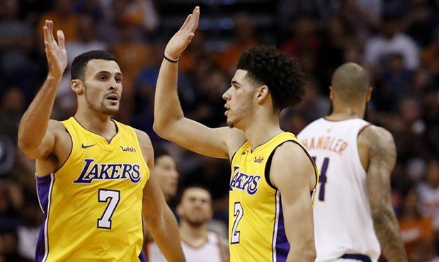 Los Angeles Lakers guard Lonzo Ball (2) and forward Larry Nance Jr. (7) high-five during the second...
