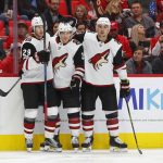 Arizona Coyotes center Nick Cousins, center, celebrates his goal against the Detroit Red Wings with Arizona Coyotes right wing Mario Kempe, of Sweden, (29) and Adam Clendening (5) in the third period of an NHL hockey game Tuesday, Oct. 31, 2017, in Detroit. (AP Photo/Paul Sancya)