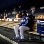 Los Angeles Dodgers starting pitcher Clayton Kershaw sits in the dugout before Game 1 of the baseball team's National League Division Series against the Arizona Diamondbacks in Los Angeles, Friday, Oct. 6, 2017. (AP Photo/Jae C. Hong)