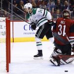 Dallas Stars left wing Jamie Benn (14) skates off to celebrate his goal against Arizona Coyotes goalie Adin Hill (31) during the first period of an NHL hockey game Thursday, Oct. 19, 2017, in Glendale, Ariz. (AP Photo/Ross D. Franklin)