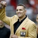 Former Arizona Cardinals quarterback Kurt Warner shows his Football Hall of Fame ring during his ring ceremony at half time of an NFL football game against the San Francisco 49ers, Sunday, Oct. 1, 2017, in Glendale, Ariz. (AP Photo/Ross D. Franklin)