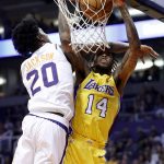 Phoenix Suns forward Josh Jackson (20) fouls Los Angeles Lakers forward Brandon Ingram (14) during the first half of an NBA basketball game, Friday, Oct. 20, 2017, in Phoenix. (AP Photo/Matt York)