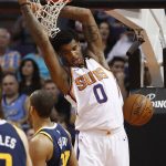 Phoenix Suns forward Marquese Chriss (0) dunks against the Utah Jazz during the first half of an NBA basketball game, Wednesday, Oct. 25, 2017, in Phoenix. (AP Photo/Matt York)