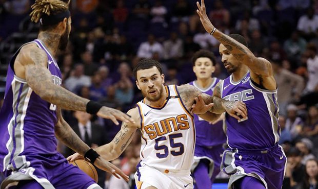Phoenix Suns guard Mike James (55) drives as Sacramento Kings center Willie Cauley-Stein, left and ...
