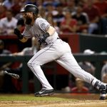 Colorado Rockies' Charlie Blackmon leaves the batter's box on an RBI sacrifice bunt during the seventh inning of the National League wild-card playoff baseball game against the Arizona Diamondbacks, Wednesday, Oct. 4, 2017, in Phoenix. (AP Photo/Ross D. Franklin)