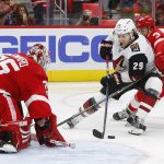 Detroit Red Wings goalie Jimmy Howard (35) stops a Arizona Coyotes right wing Mario Kempe, of Sweden, (29) shot as Nick Jensen (3) defends in the third period of an NHL hockey game Tuesday, Oct. 31, 2017, in Detroit. (AP Photo/Paul Sancya)