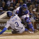 Chicago Cubs catcher Willson Contreras tags out Los Angeles Dodgers' Chris Taylor (3) at home plate during the fourth inning of Game 5 of baseball's National League Championship Series, Thursday, Oct. 19, 2017, in Chicago. (AP Photo/Nam Y. Huh)