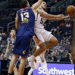 Phoenix Suns forward guard Mike James (55) drives to the basket as Brisbane Bullets forward Tom Jervis defends during the second half of an NBA basketball exhibition game Friday, Oct. 13, 2017, in Phoenix. (AP Photo/Ralph Freso)