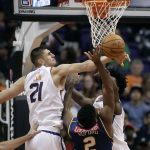 Phoenix Suns center Alex Len (21) blocks the shot of Brisbane Bullets forward Perrin Buford (2) during the second half of an NBA basketball exhibition game Friday, Oct. 13, 2017, in Phoenix. (AP Photo/Ralph Freso)