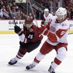Arizona Coyotes center Nick Cousins (25) and Detroit Red Wings left wing Justin Abdelkader vie for the puck during the second period of an NHL hockey game, Thursday, Oct. 12, 2017, in Glendale, Ariz. (AP Photo/Rick Scuteri)