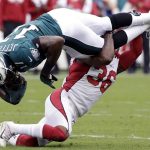 Philadelphia Eagles' Alshon Jeffery, top, is tackled by Arizona Cardinals' Budda Baker during the first half of an NFL football game, Sunday, Oct. 8, 2017, in Philadelphia. (AP Photo/Michael Perez)