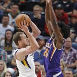 Utah Jazz forward Joe Ingles, left, passes the ball as Phoenix Suns forward Josh Jackson (20) defends during the first half of a preseason NBA basketball game Friday, Oct. 6, 2017, in Salt Lake City. (AP Photo/Rick Bowmer)